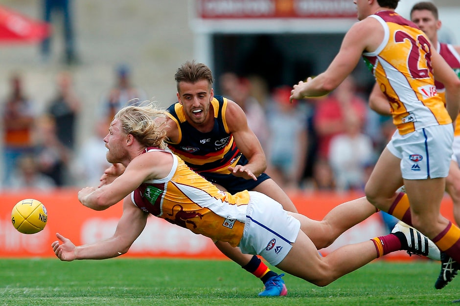 AFL 2017 JLT Community Series - Adelaide Crows v Brisbane Lions NOARLUNGA, AUSTRALIA - MARCH 11: Jordan Gallucci of the Crows tackles Daniel Rich of the Lions during the AFL 2017 JLT Community Series match between the Adelaide Crows and the Brisbane Lions at Hickenbotham Oval on March 11, 2017 in Noarlunga, Australia. (Photo by James Elsby/AFL Media)